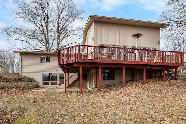 rear view of property featuring a deck