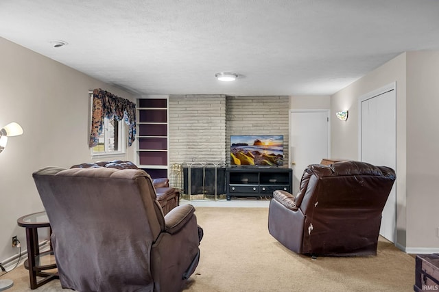 carpeted living room featuring a textured ceiling and a fireplace