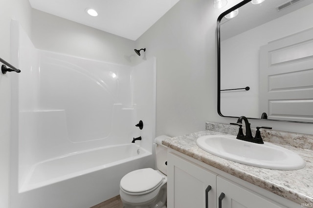 full bathroom with vanity, bathing tub / shower combination, and toilet