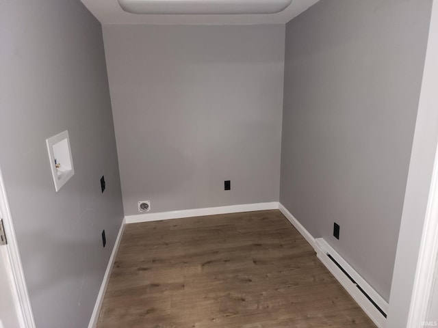 clothes washing area with washer hookup, electric dryer hookup, dark hardwood / wood-style floors, and a baseboard heating unit