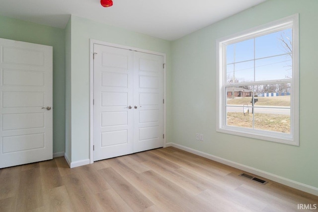 3711 Kansas Rd, Evansville, IN 47725 - unfurnished bedroom with light wood finished floors and a closet