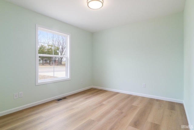3711 Kansas Rd, Evansville, IN 47725 - empty room with light wood-style floors and baseboards
