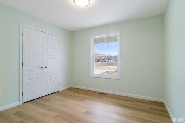 3711 Kansas Rd, Evansville, IN 47725 - unfurnished bedroom featuring light wood finished floors and a closet