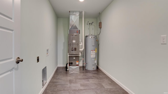 utility room featuring water heater