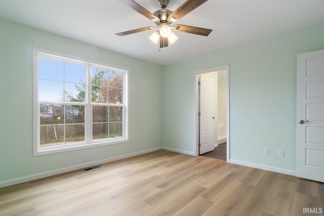 3711 Kansas Rd, Evansville, IN 47725 - unfurnished bedroom with wood finished floors, ensuite bathroom, and ceiling fan