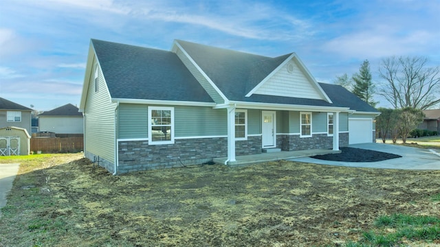 view of front of house with a porch and a garage