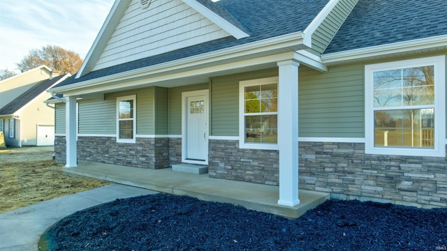 entrance to property featuring covered porch