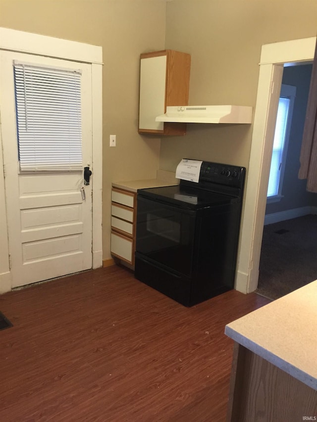 kitchen featuring dark hardwood / wood-style floors and black electric range