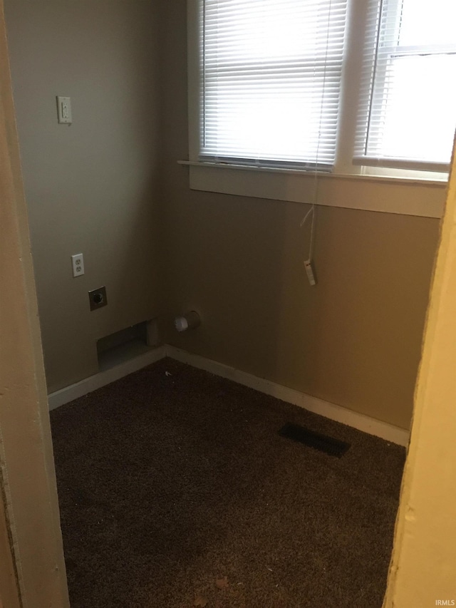 carpeted spare room with a healthy amount of sunlight