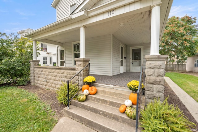 property entrance with covered porch