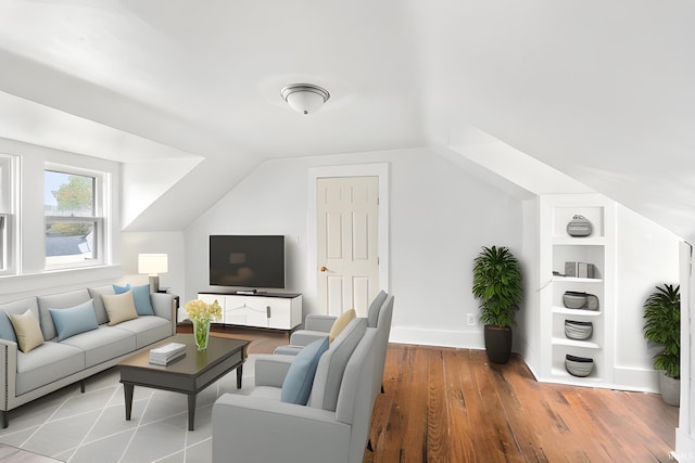 living room with wood-type flooring and lofted ceiling