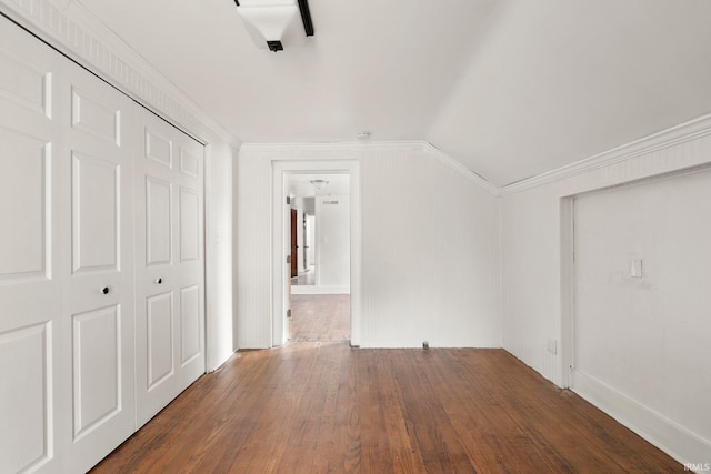 additional living space with dark hardwood / wood-style flooring and lofted ceiling