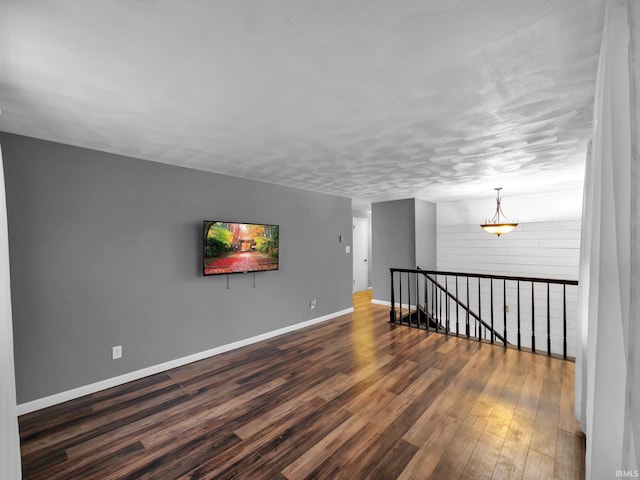 unfurnished room featuring dark hardwood / wood-style floors