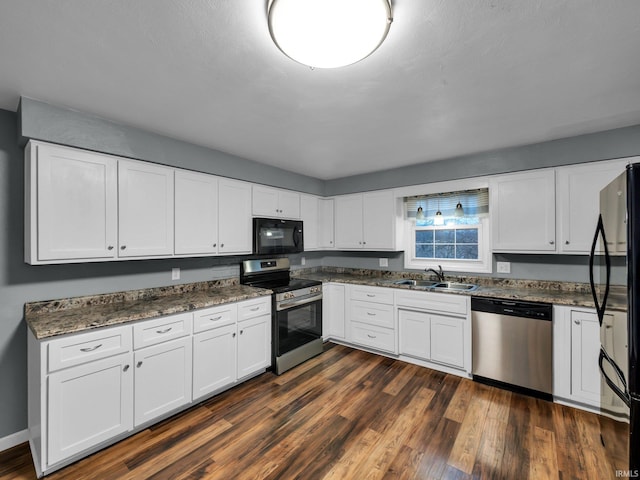 kitchen featuring sink, white cabinets, black appliances, and dark hardwood / wood-style floors