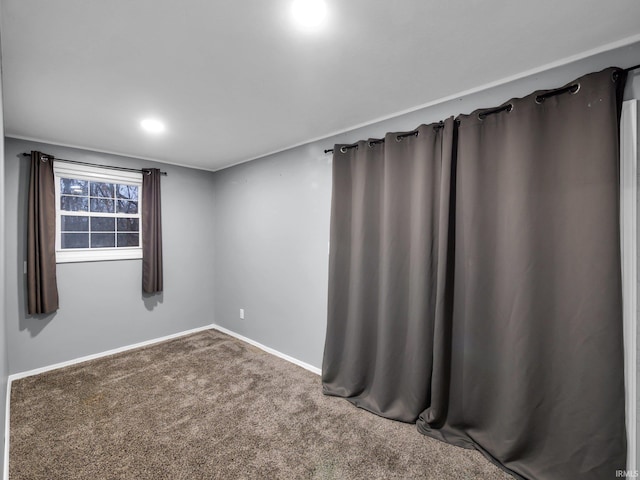 unfurnished room with carpet flooring