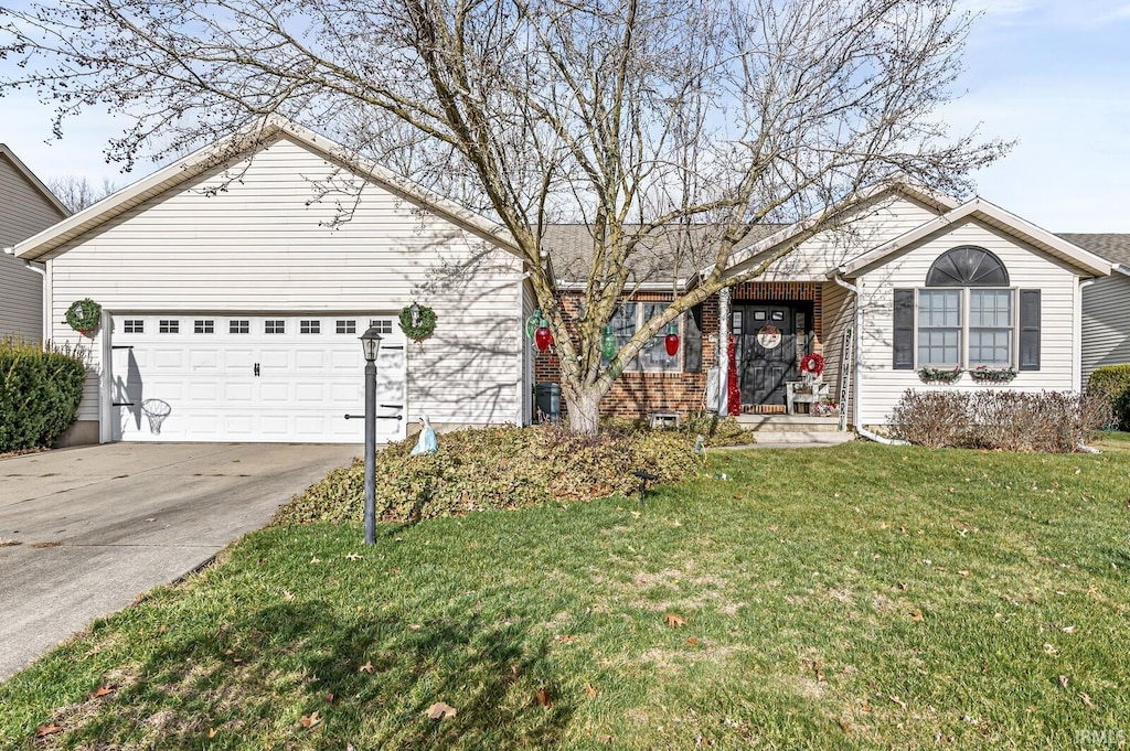 ranch-style house with a garage and a front lawn