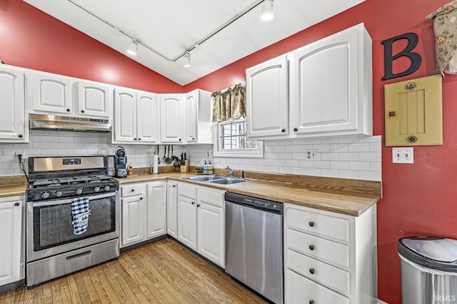 kitchen featuring appliances with stainless steel finishes and white cabinetry