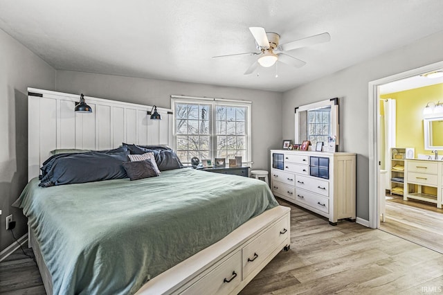 bedroom with light hardwood / wood-style floors and ceiling fan