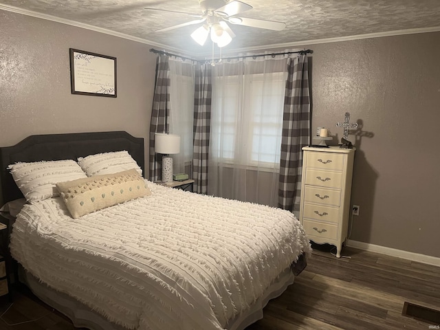 bedroom with a textured ceiling, ceiling fan, wood-type flooring, and ornamental molding