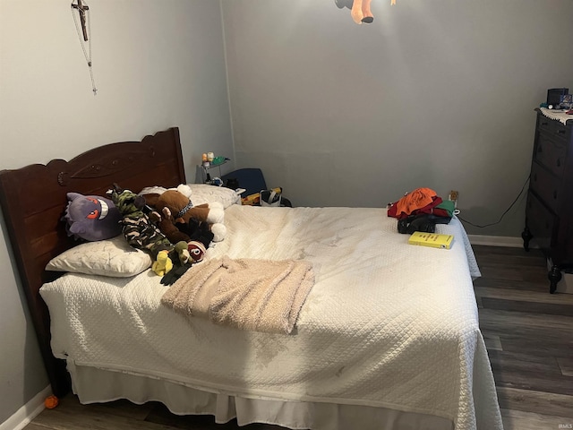 bedroom featuring dark hardwood / wood-style flooring