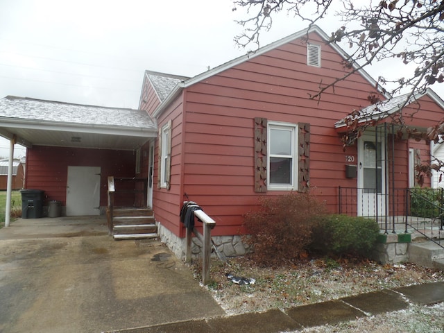 view of property exterior featuring a carport