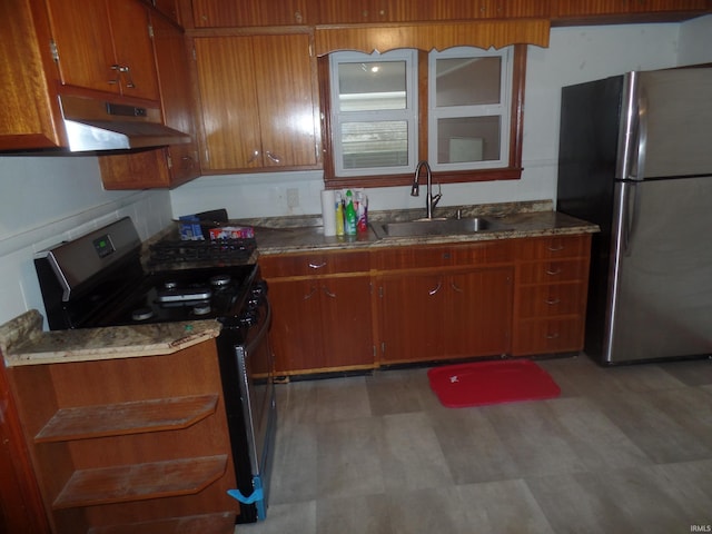 kitchen with stainless steel fridge, black stove, and sink