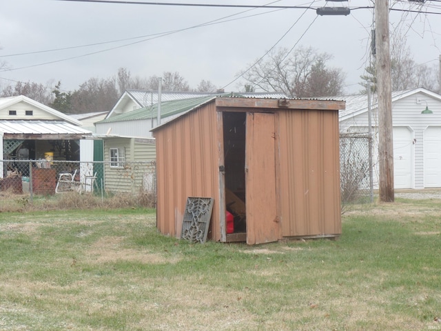 view of outbuilding featuring a yard