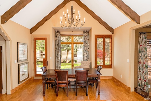 dining room with beamed ceiling, light wood-type flooring, high vaulted ceiling, and a chandelier