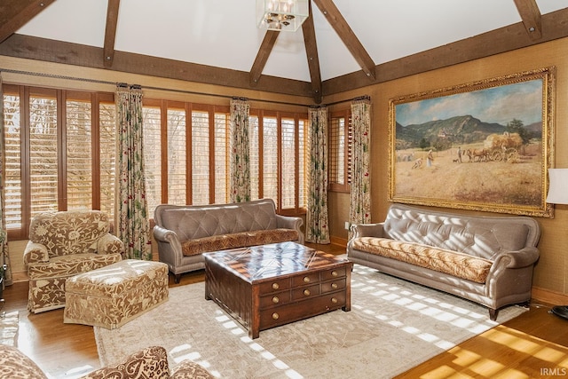 interior space featuring vaulted ceiling with beams