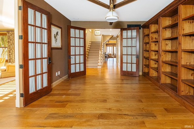 interior space featuring french doors and light hardwood / wood-style flooring