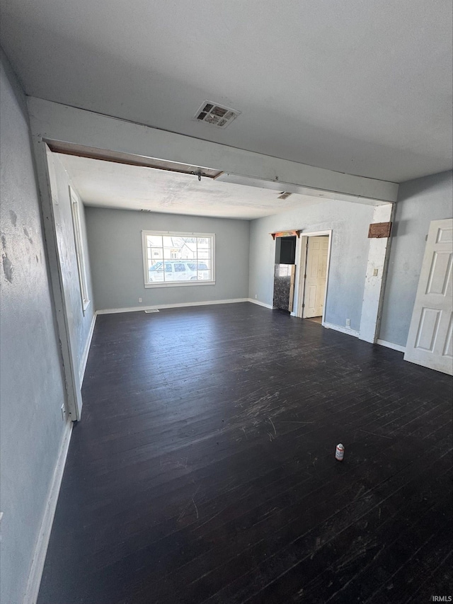 empty room with dark wood-type flooring