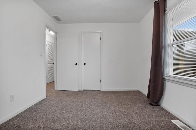 unfurnished bedroom featuring carpet