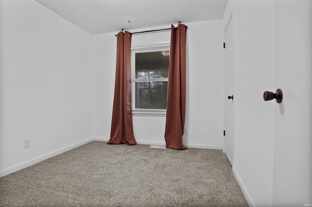 spare room featuring carpet