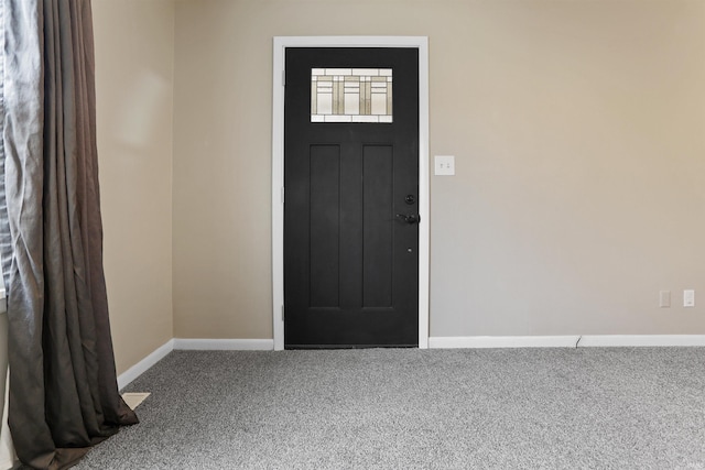 view of carpeted entrance foyer