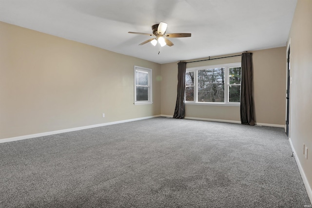 carpeted empty room with ceiling fan