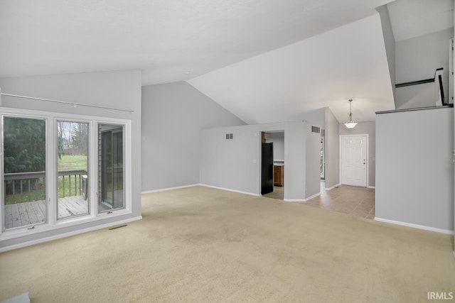 additional living space with light colored carpet and lofted ceiling