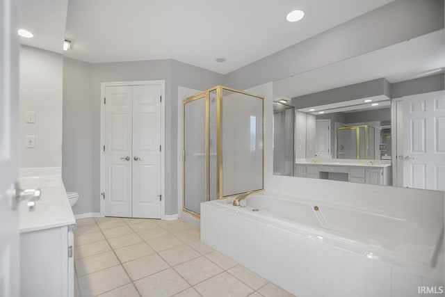 full bathroom with toilet, tile patterned floors, vanity, and separate shower and tub