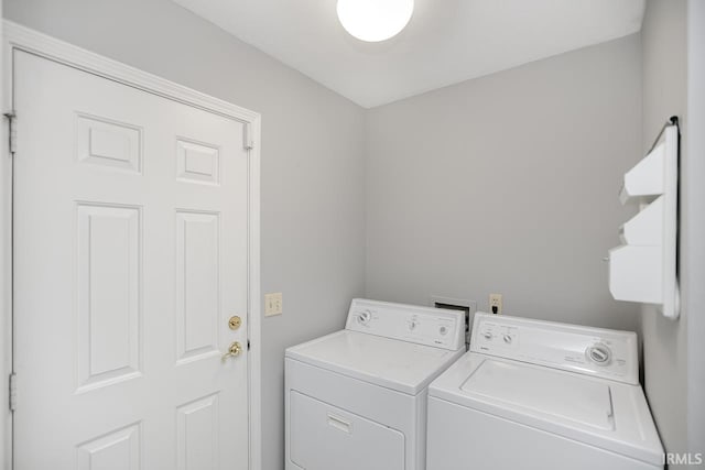 laundry room featuring washing machine and clothes dryer