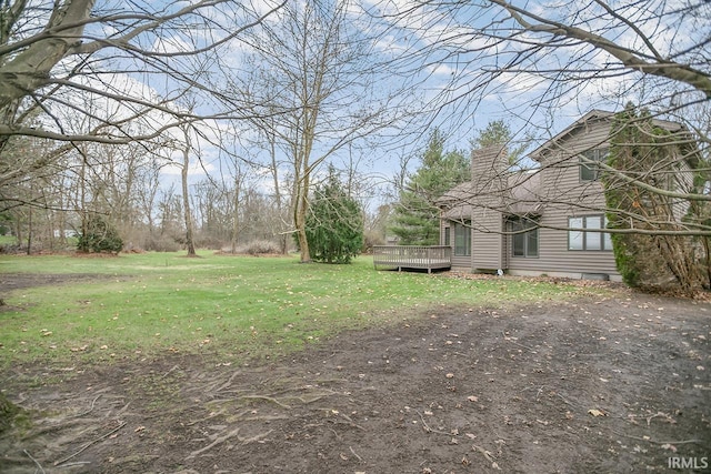 view of yard with a deck