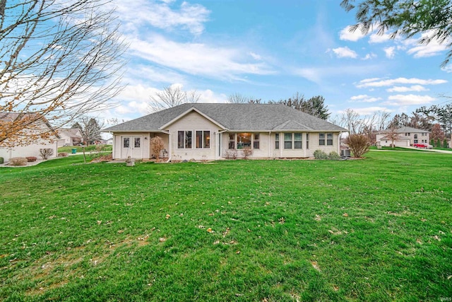 ranch-style house featuring a front lawn