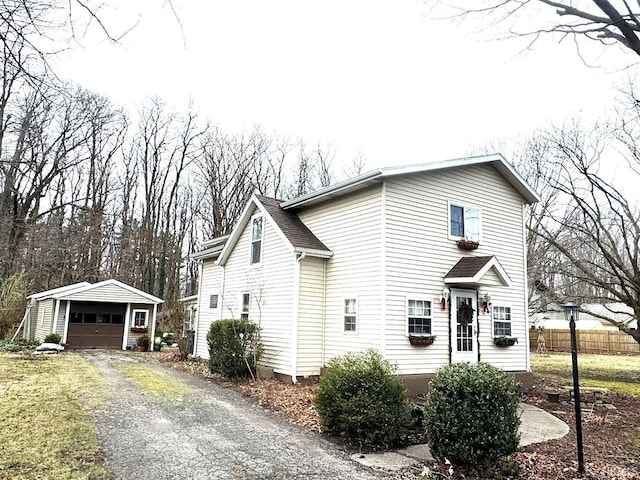 view of front of house featuring an outbuilding and a garage