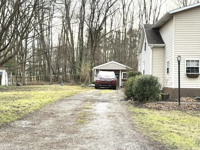 view of property exterior featuring an outbuilding and a garage