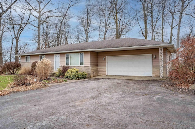 single story home featuring a garage