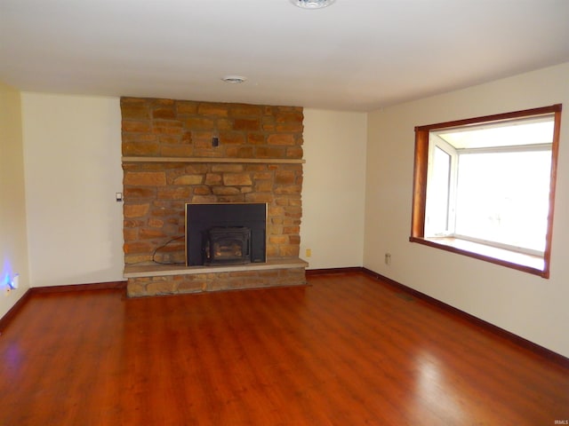 unfurnished living room featuring hardwood / wood-style flooring