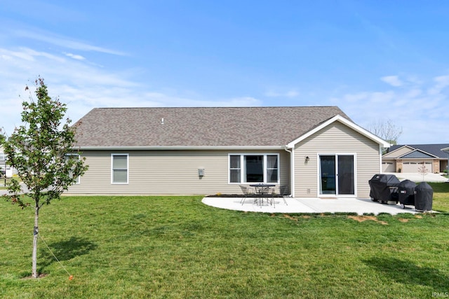 back of property featuring a lawn and a patio area