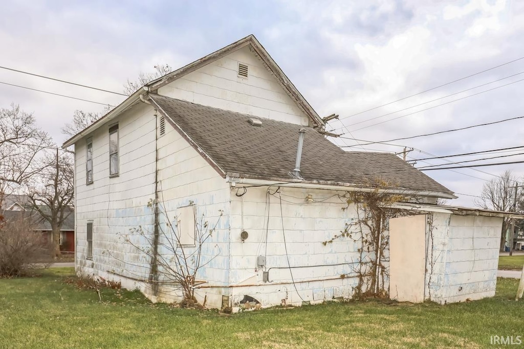 view of property exterior with a yard