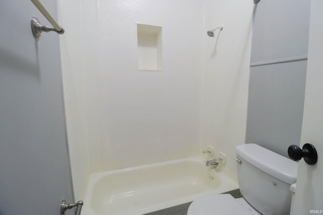 bathroom with toilet and shower / washtub combination