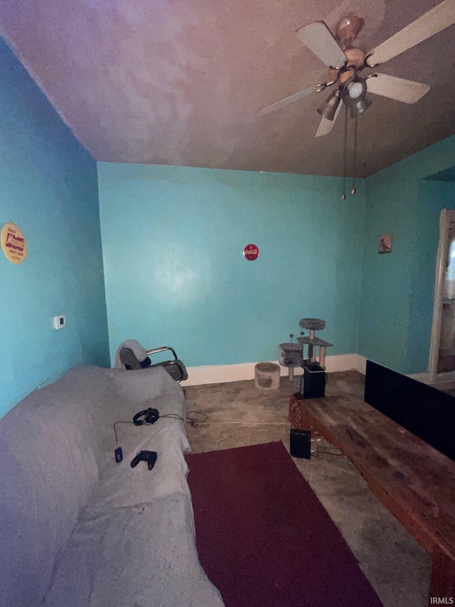 interior space featuring ceiling fan and vaulted ceiling