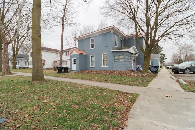 view of home's exterior with a yard