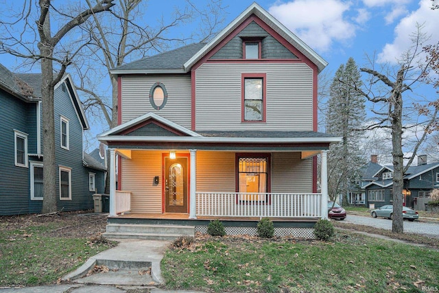 victorian-style house featuring covered porch